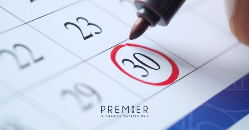Date circled on calendar in red as plans are made for upcoming orthopedic surgery with Premier Orthopaedic and Trauma Specialists, but could surgery be postponed?
